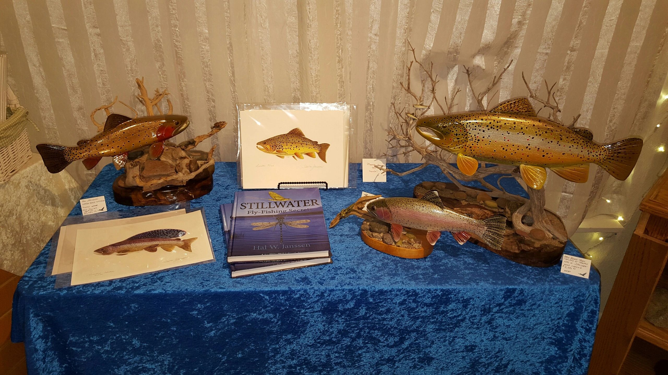 Museum display with taxidermied fish specimens and Stillwater book by Hal W. Janssen