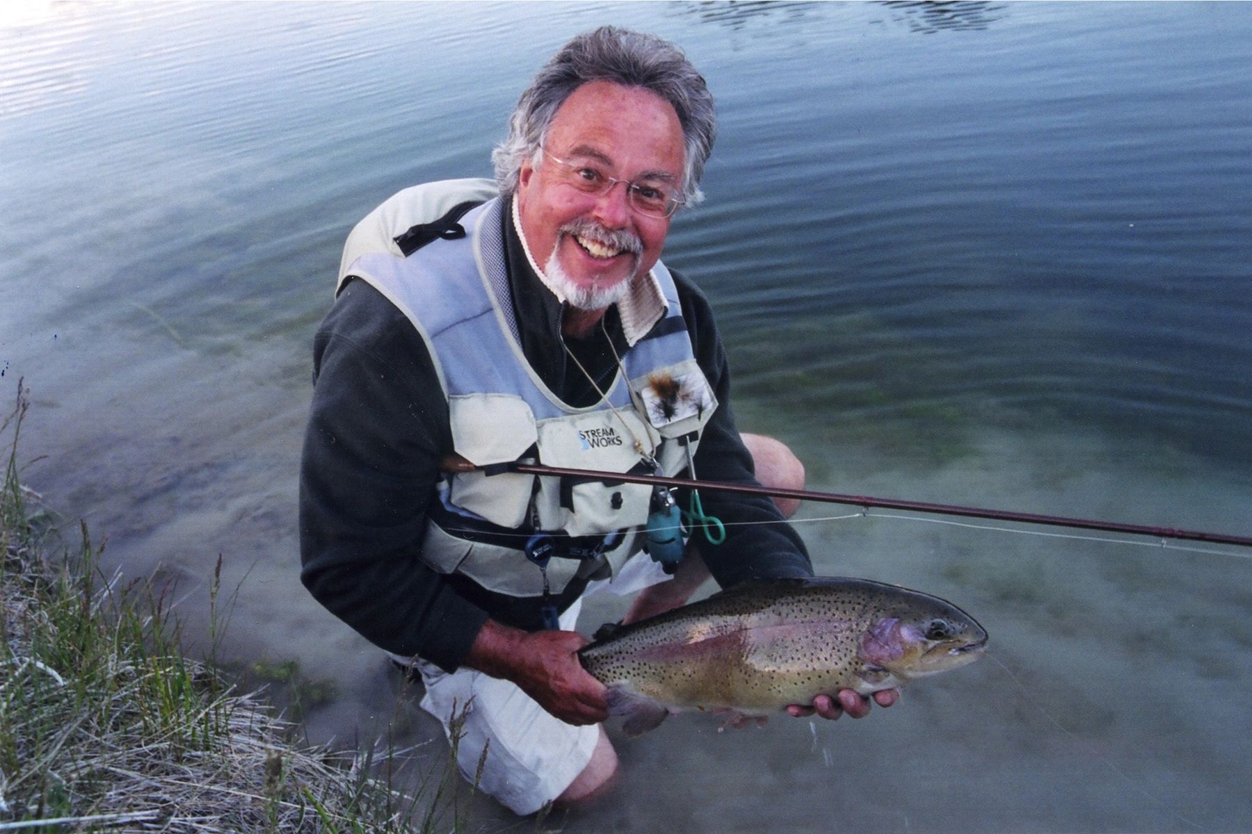Hal Janssen holding a freshly caught trout